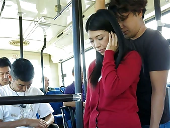 Black-haired Aimi Nagano gets her cock-squeezing crevice opened up in a bus ride
